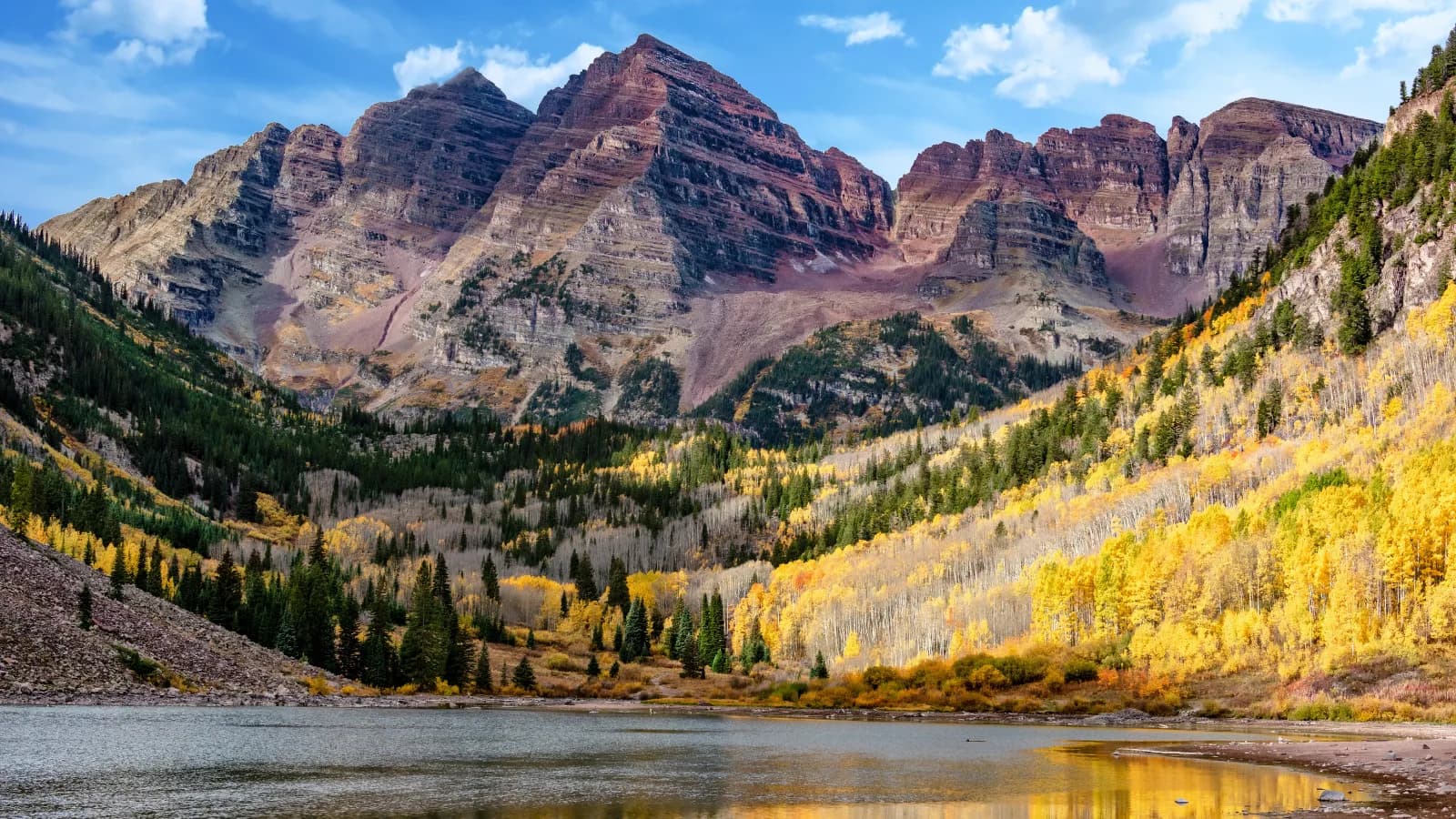 Maroon Bells above Maroon Lake and golden autumn aspens in Colorado